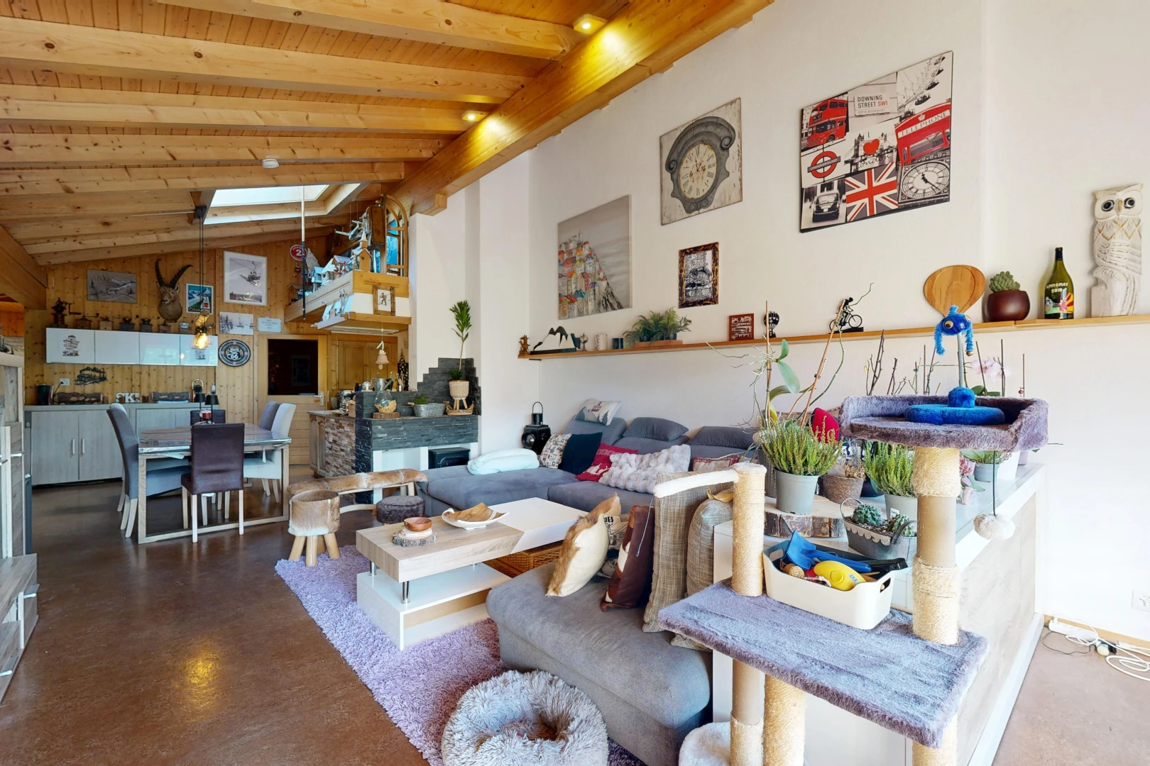 living / dining area featuring a high wooden beamed ceiling, finished concrete floors, and recessed lighting