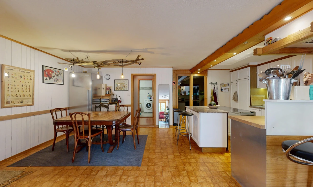 dining space featuring hanging light fixtures and light floors