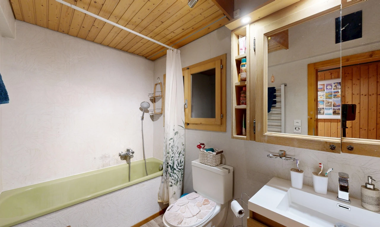 full bathroom with shower / tub combo with curtain, wooden ceiling, and vanity