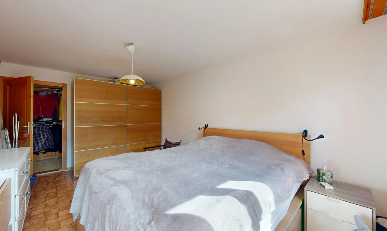 room with a closet and decorative light fixtures