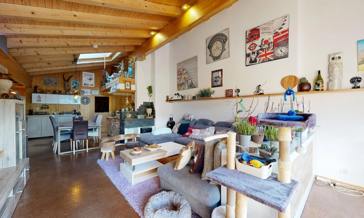 living / dining area featuring a high wooden beamed ceiling, finished concrete floors, and recessed lighting