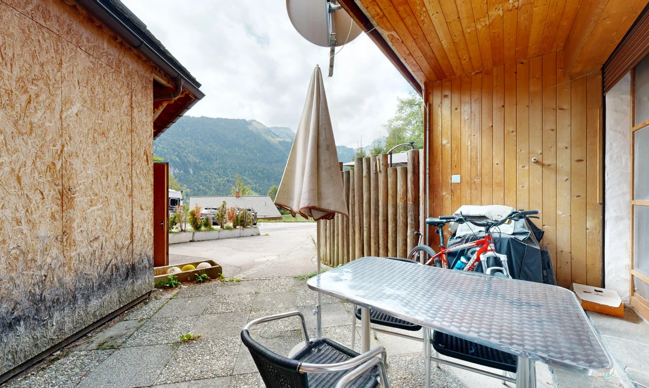 terrace with a mountain view, a patio area, and outdoor dining area