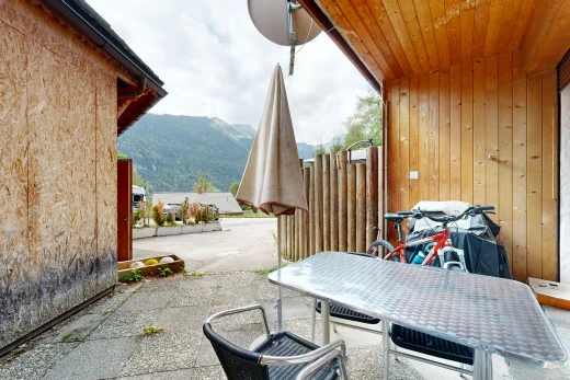 terrace with a mountain view, a patio area, and outdoor dining area