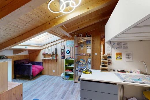 room / bedroom featuring lofted ceiling with beams, light wood finished floors, wooden walls, and wooden ceiling