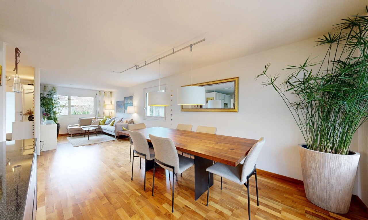 living / dining area with rail lighting and light wood-style floors