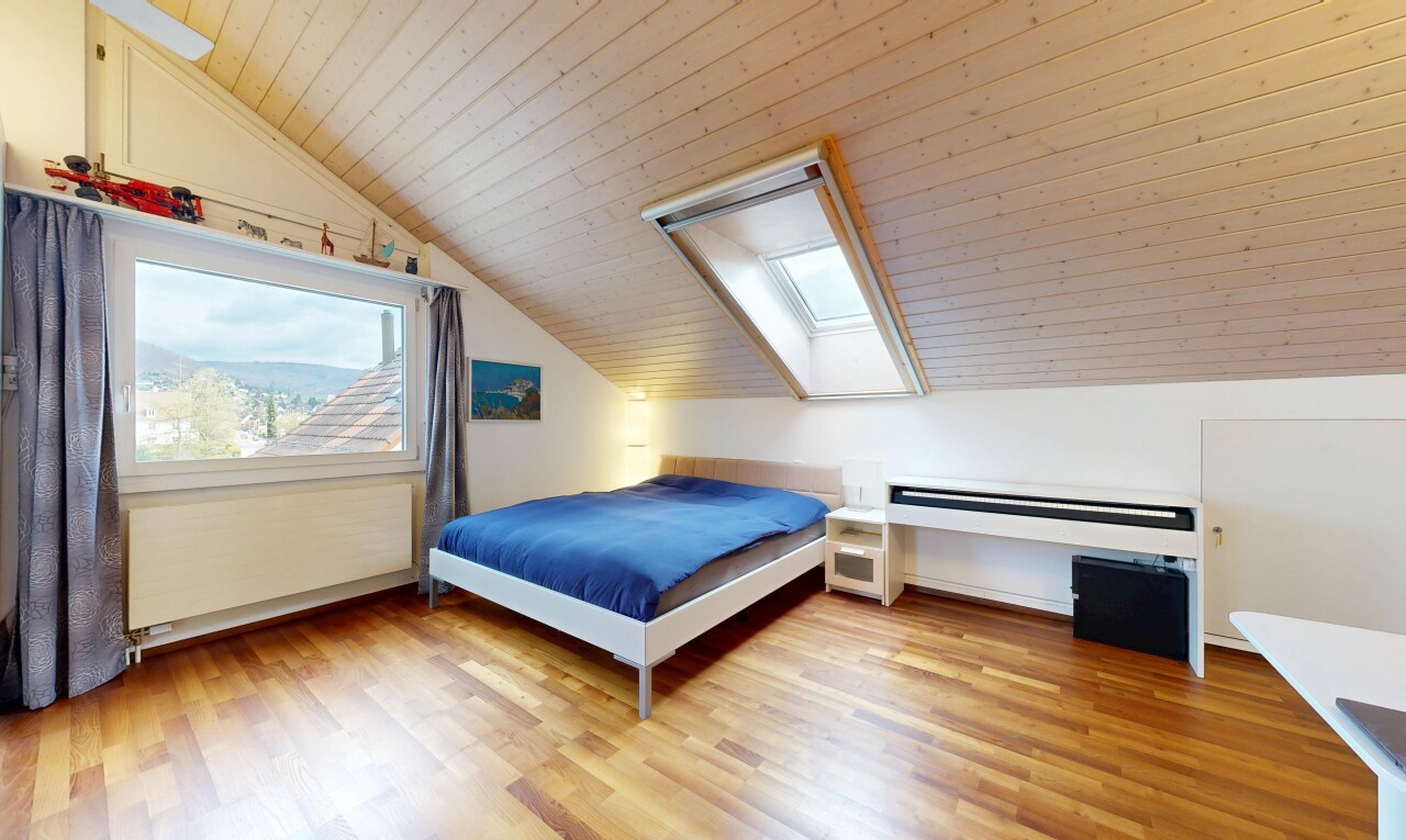 room with light wood finished floors, a skylight, radiator, and a vaulted wood ceiling