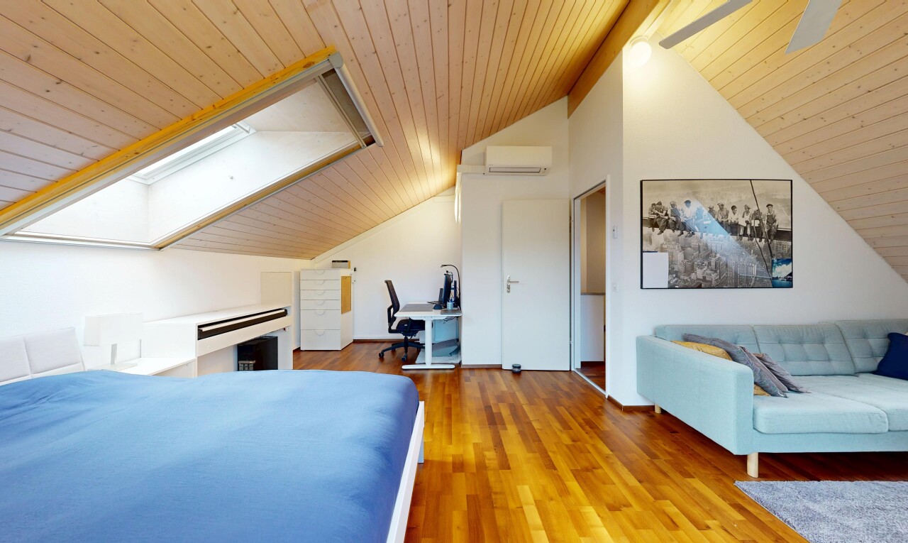 room / bedroom with wood ceiling, an office area, a skylight, and wood finished floors