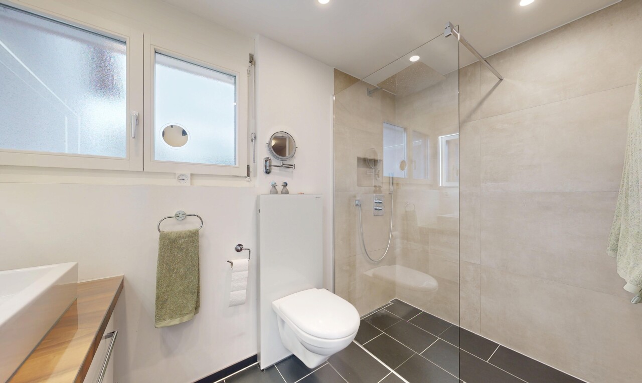 full bathroom with a walk in shower, vanity, recessed lighting, and dark tile patterned flooring