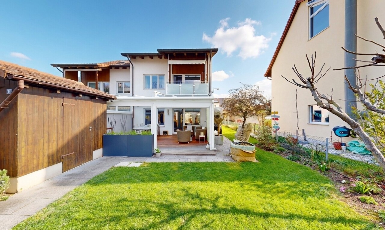 outdoor house featuring a balcony, stucco siding, a patio, and outdoor lounge area