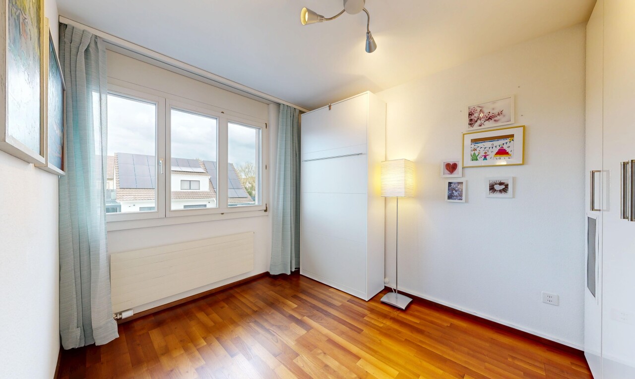 empty room with radiator heating unit and light wood-style flooring