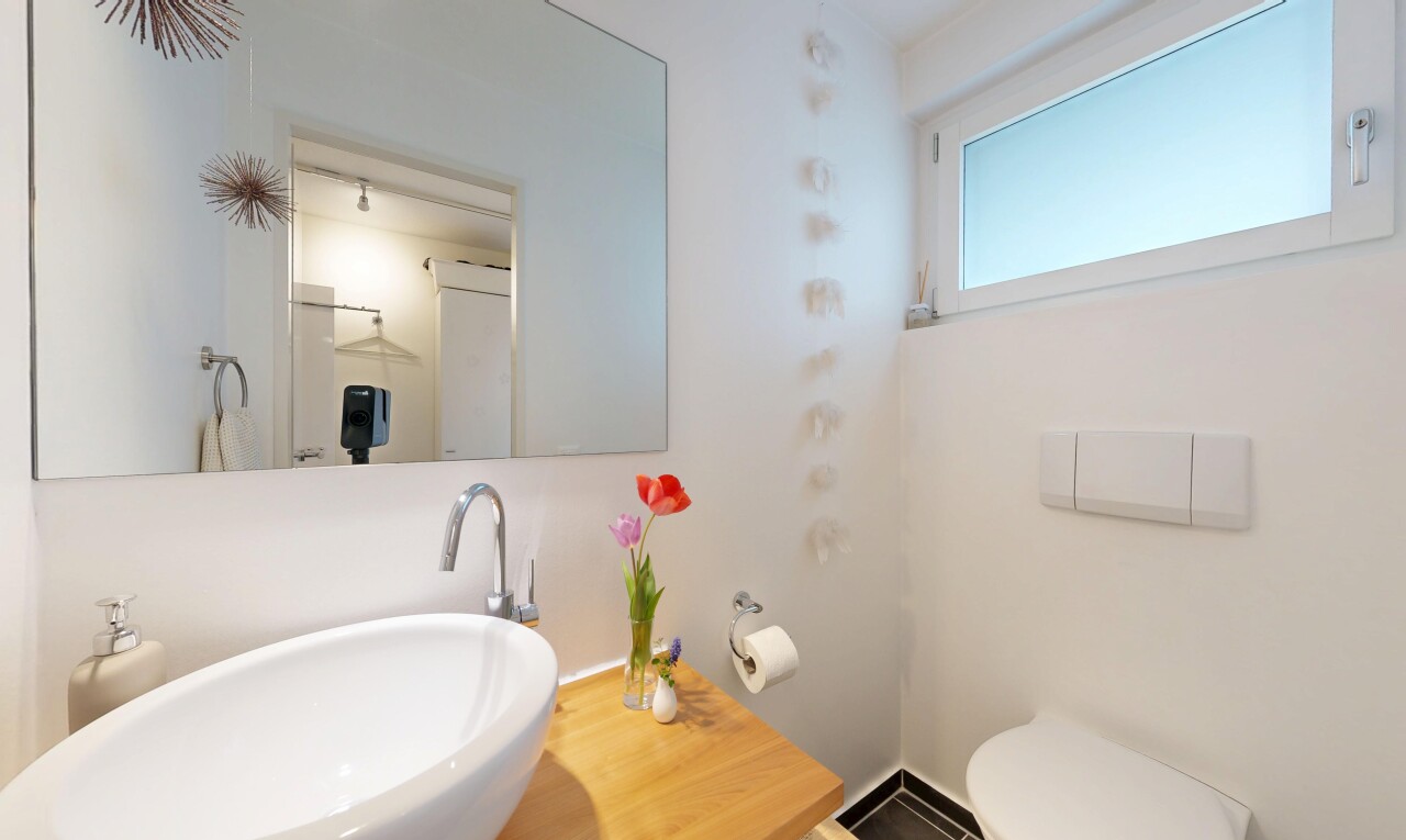 half bath featuring a sink
