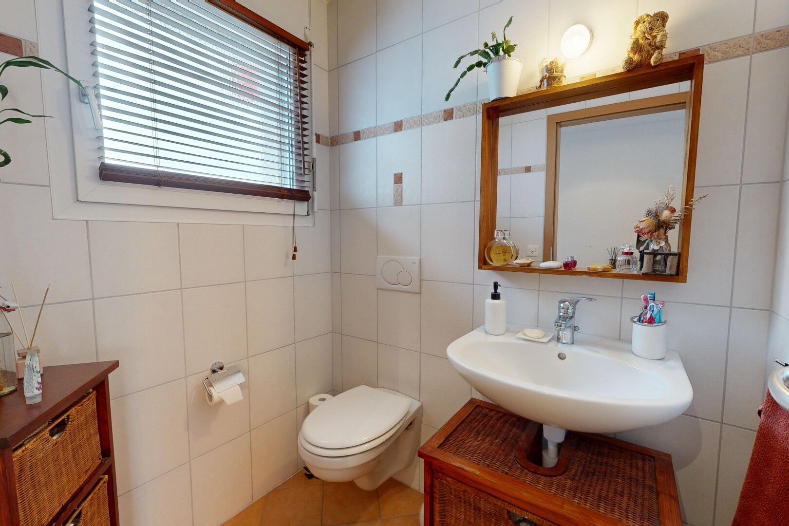 bathroom featuring tile walls, vanity, and light tile patterned flooring