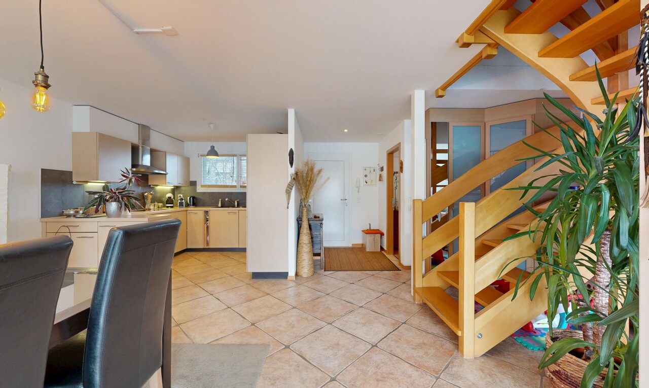 staircase with tile patterned floors