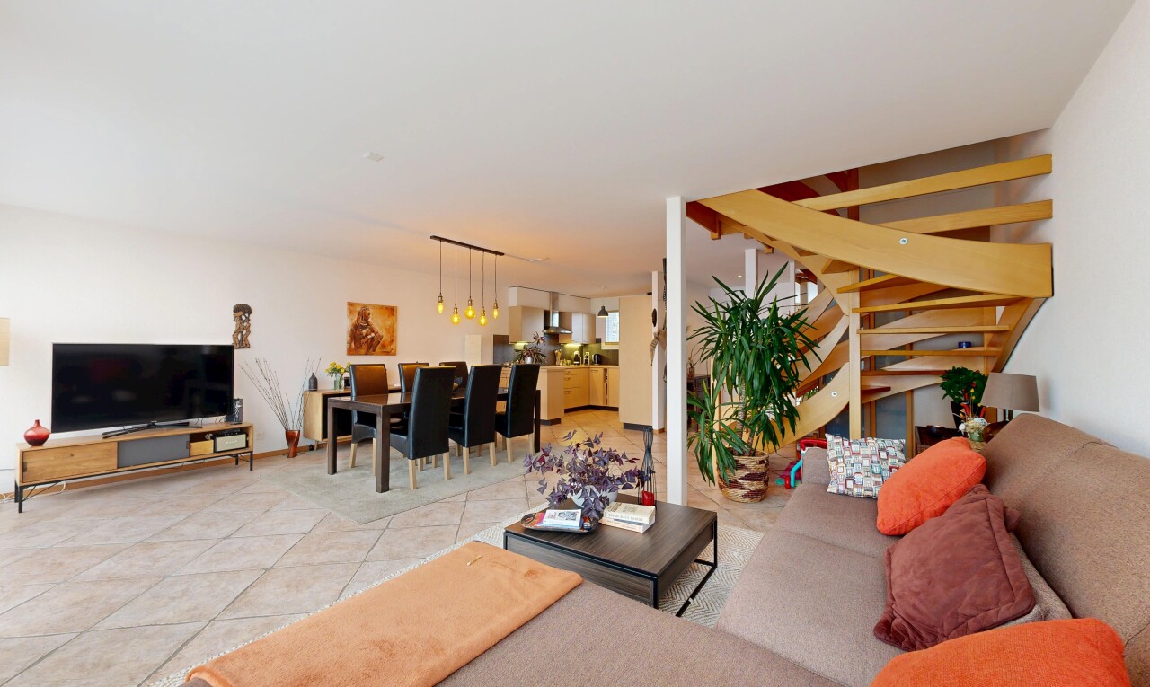living / dining area with light tile patterned flooring