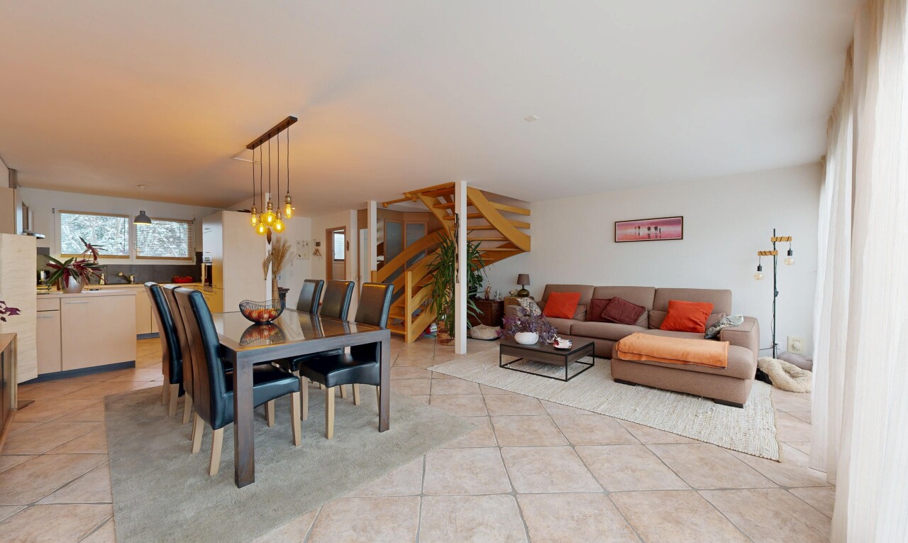living room featuring stairs and light tile patterned floors
