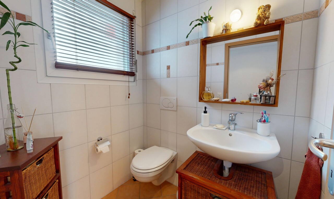 bathroom featuring tile walls, vanity, and light tile patterned flooring