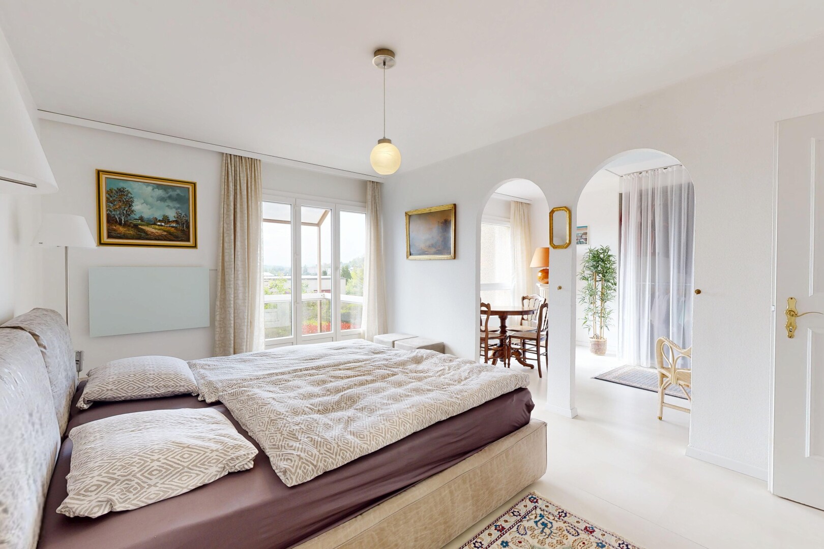 room / bedroom with arched walkways