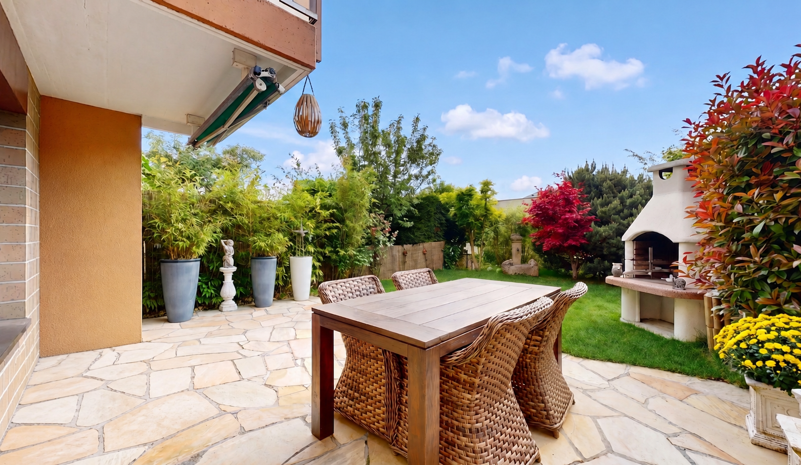 patio / terrace with a patio area, outdoor dining space, a fireplace, and a fenced backyard