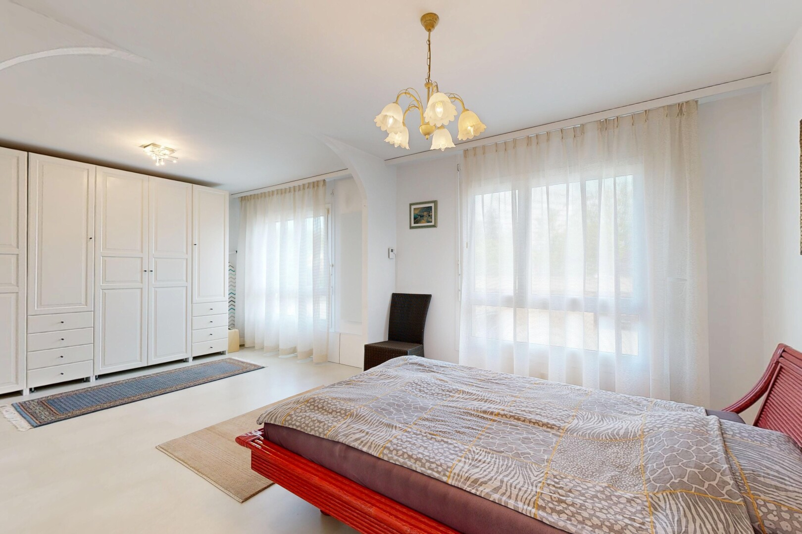 room / bedroom featuring a chandelier