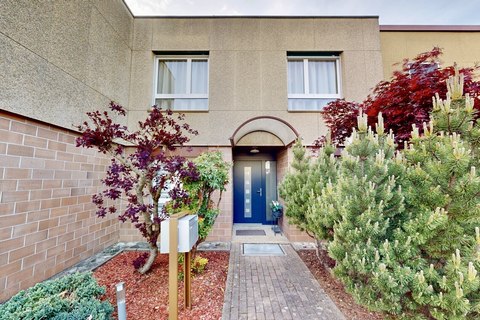 outdoor house with stucco siding