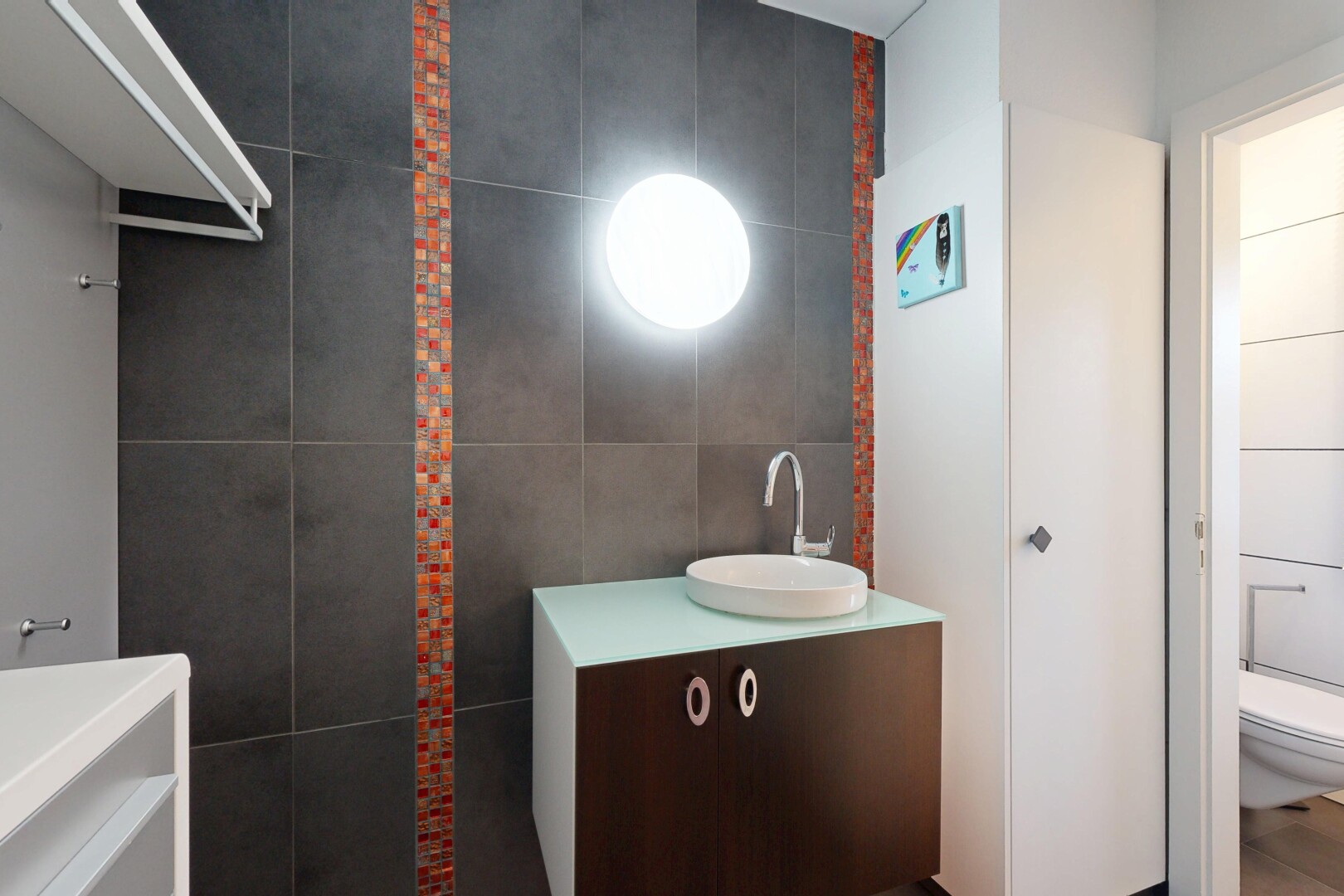 bathroom featuring tile walls and vanity