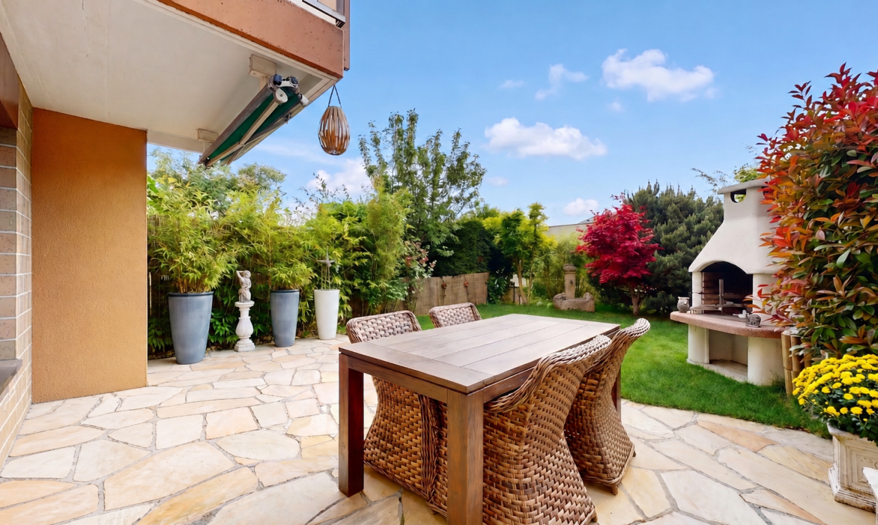 patio / terrace with a patio area, outdoor dining space, a fireplace, and a fenced backyard