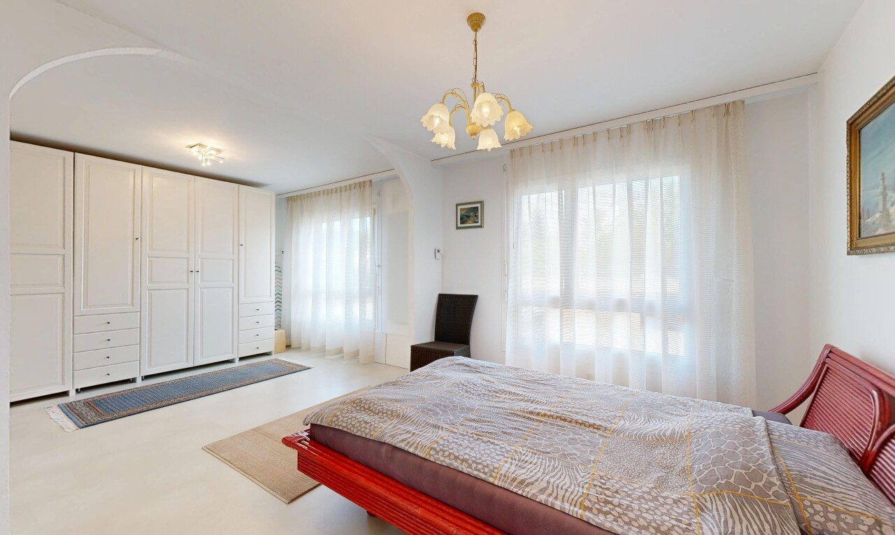 room / bedroom featuring a chandelier
