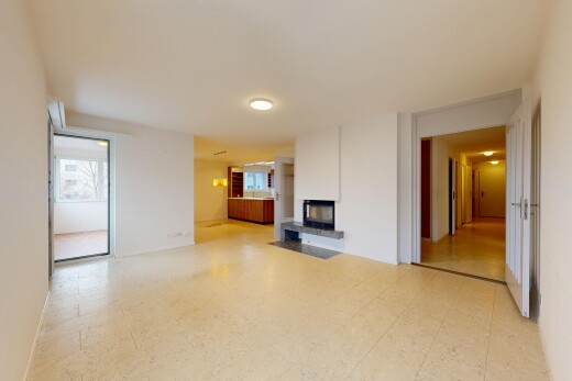 unfurnished living room featuring light floors and a multi sided fireplace