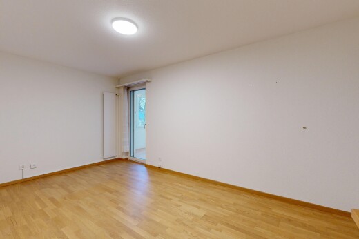spare room with light wood finished floors and baseboards