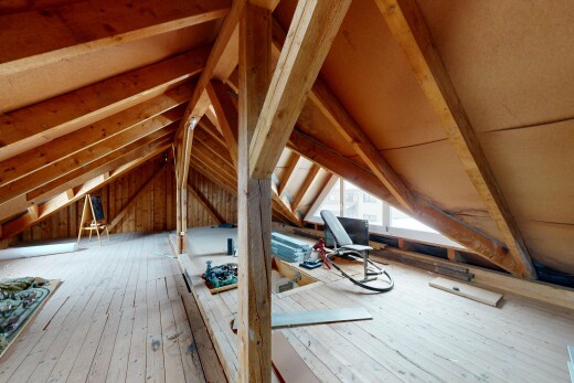 empty room with wood-type flooring and lofted ceiling