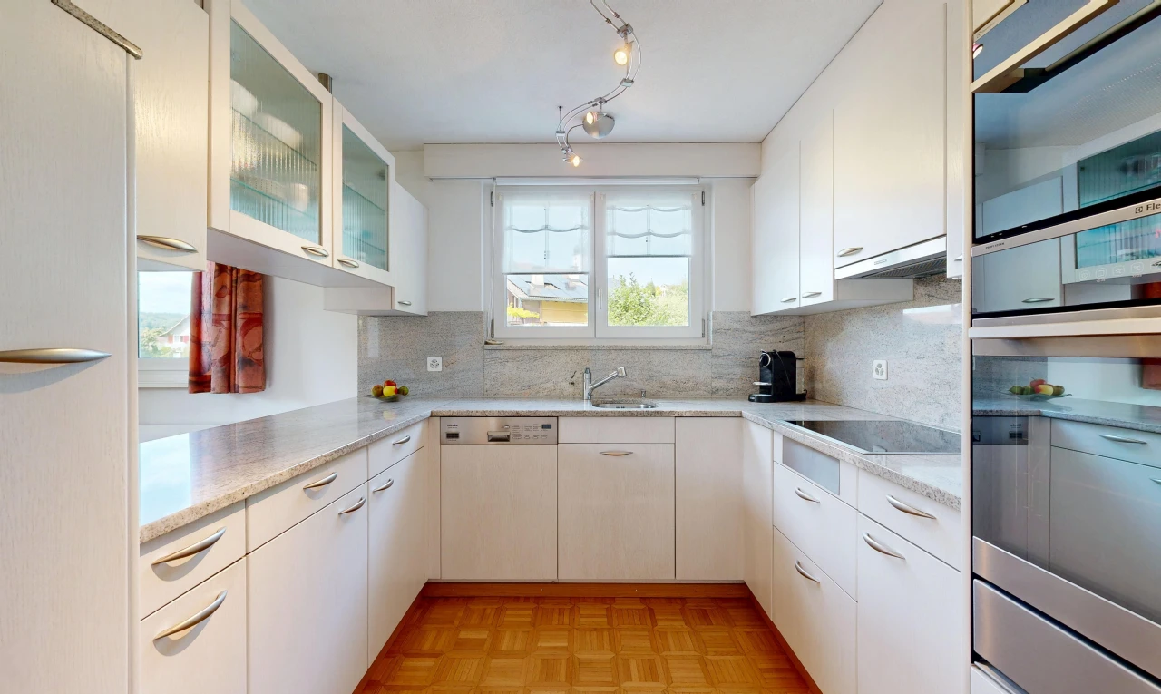 küche mit light countertops, glass insert cabinets, schränke mit glastüren, light floor, und parquet floor