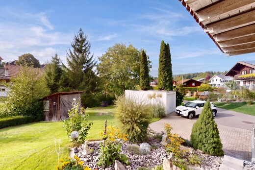garden featuring a lawn and a storage unit