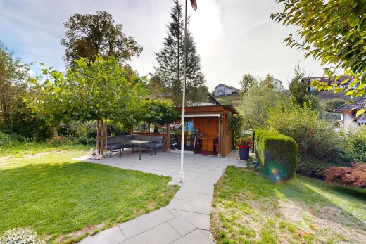 garden featuring a patio area and a lawn