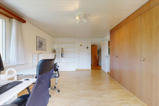 office space with built in features and light wood-type flooring