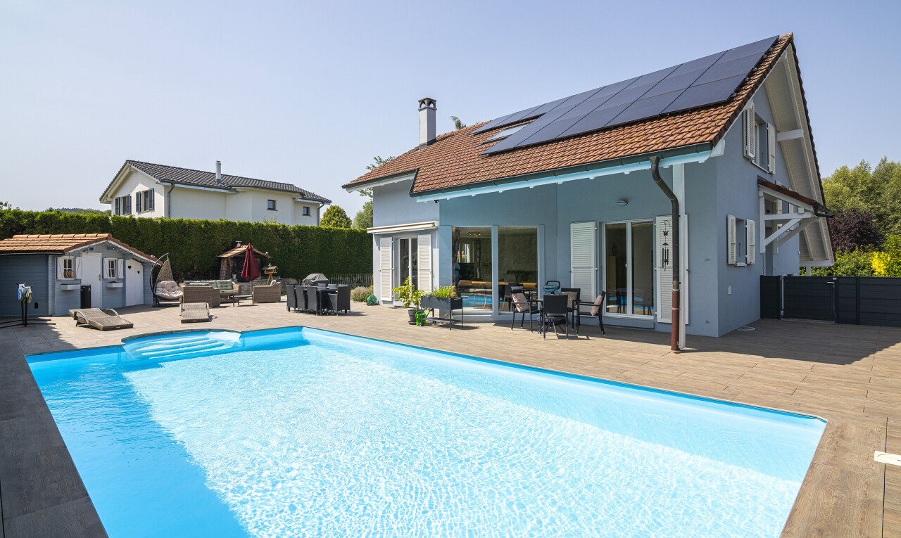 view of pool featuring outdoor dining space, a patio area, and an outdoor structure