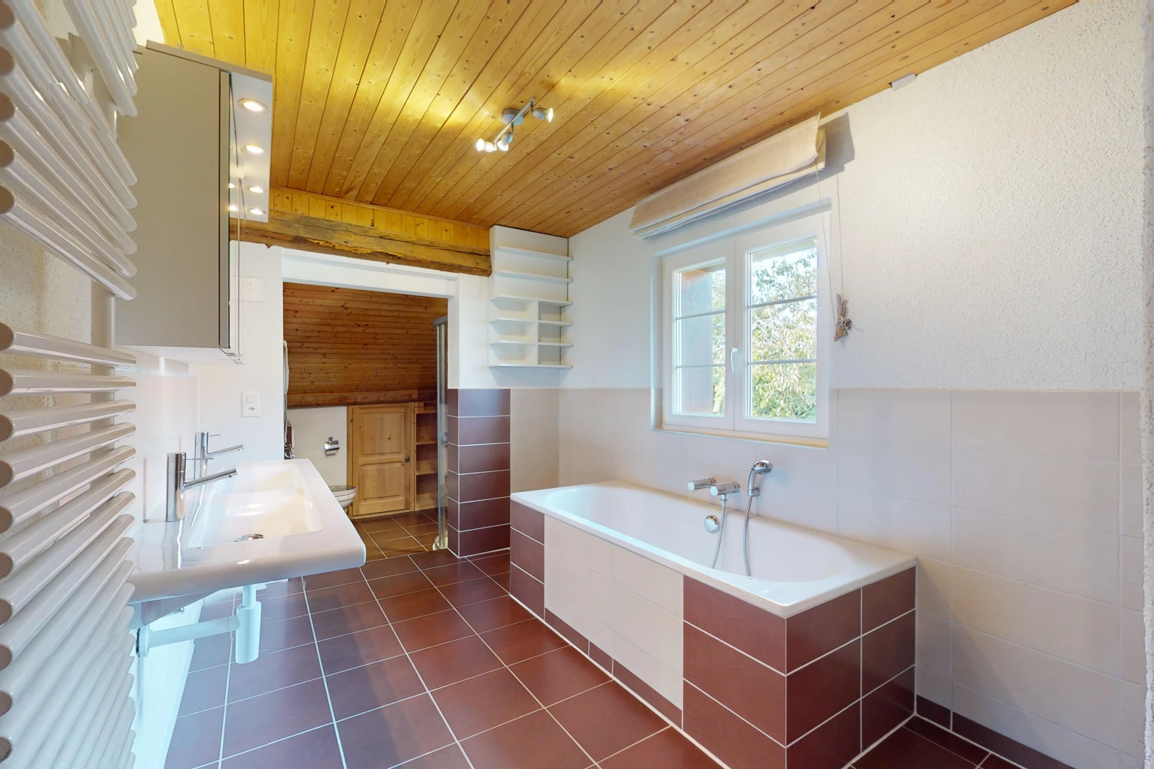 bathroom featuring tile patterned floors, wooden ceiling, a tub, and sink