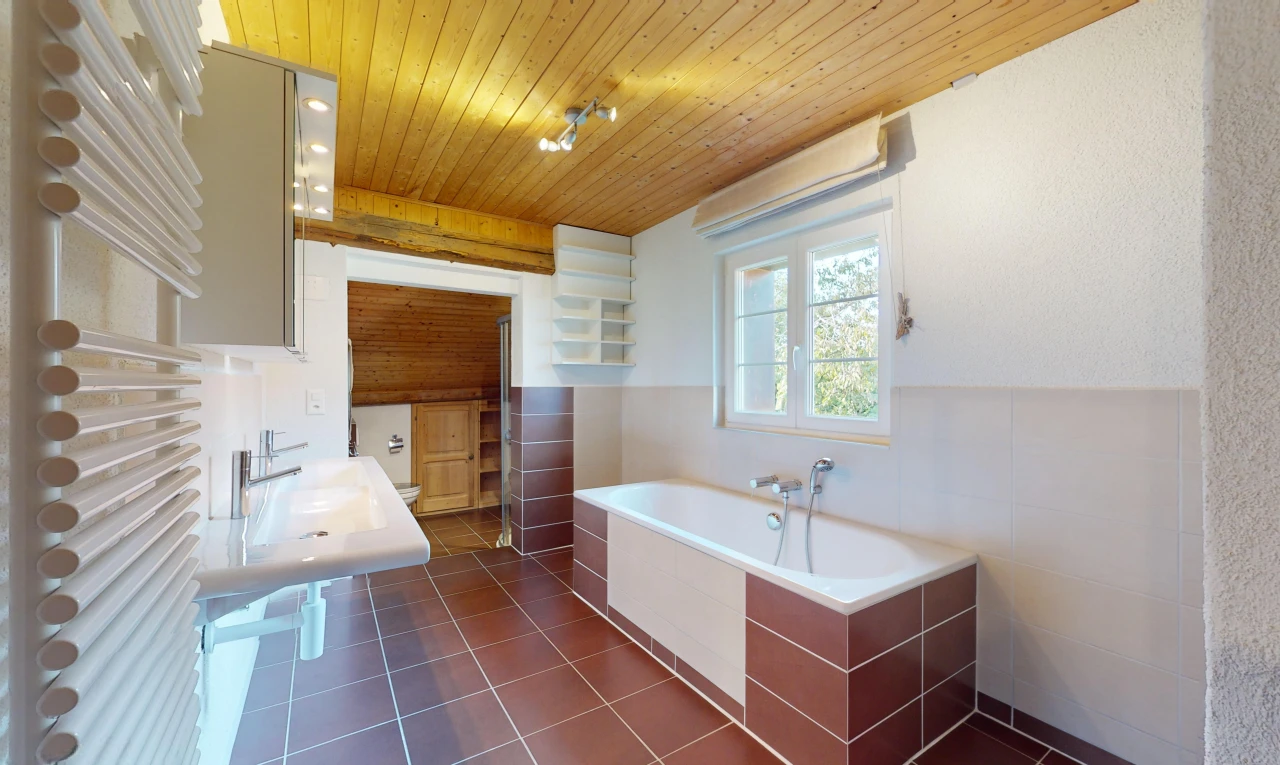 bathroom featuring tile patterned floors, wooden ceiling, a tub, and sink