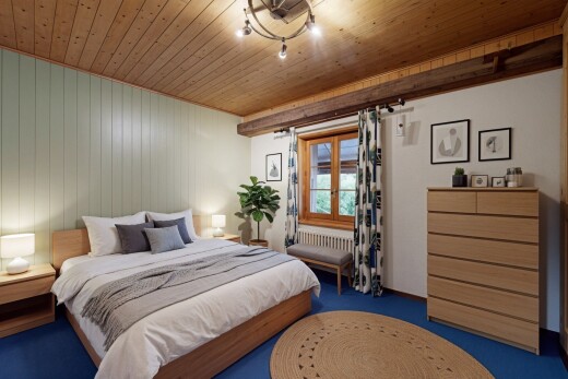 carpeted room featuring wood ceiling