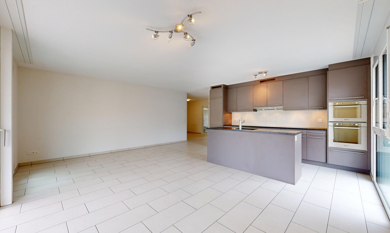 küche mit deckenbeleuchtung, light floor, dark countertops, arbeitsplatten, und opens to living area