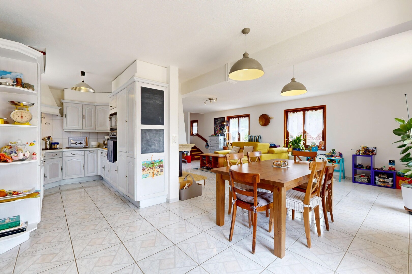 dining space featuring light tile patterned floors