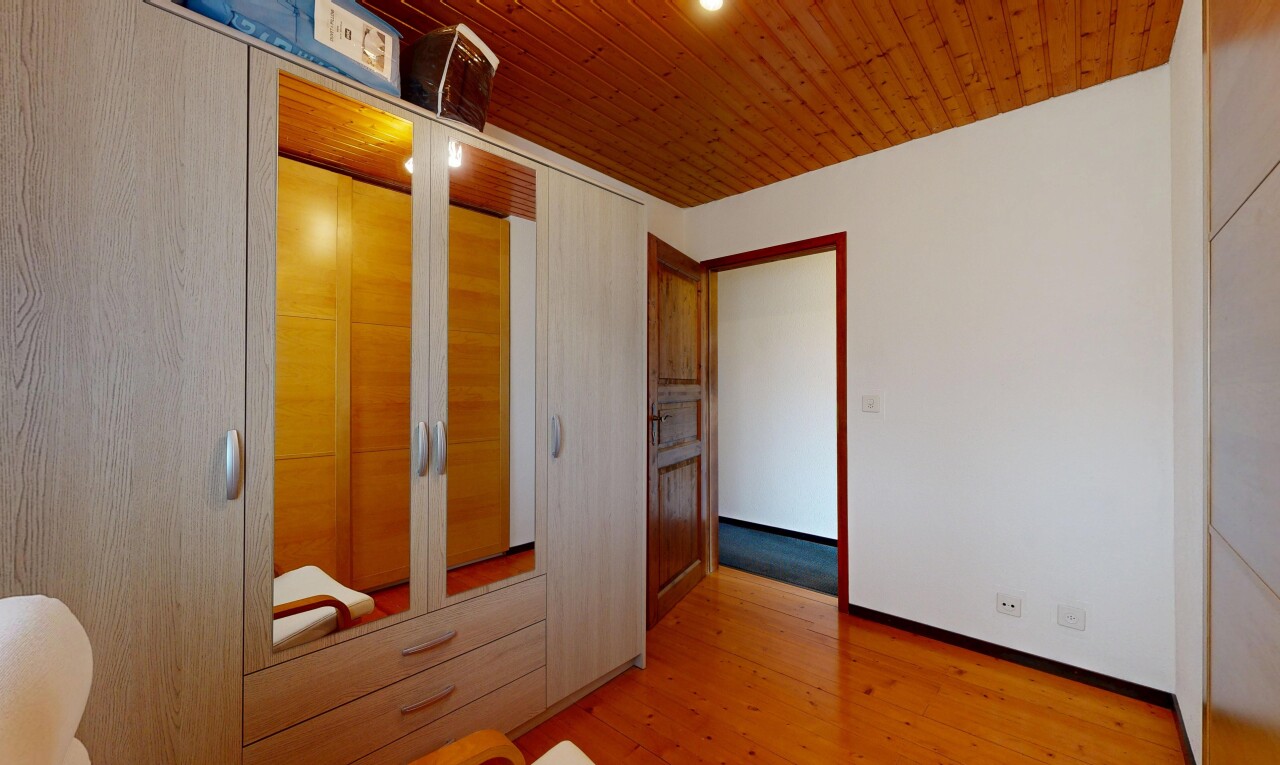 unfurnished room featuring a closet, light wood finished floors, and wood ceiling