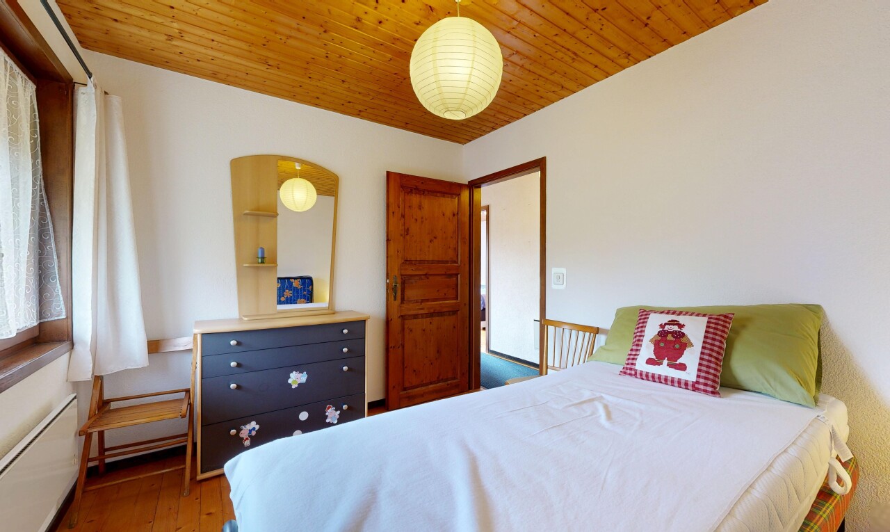 room featuring light wood-style floors and wood ceiling