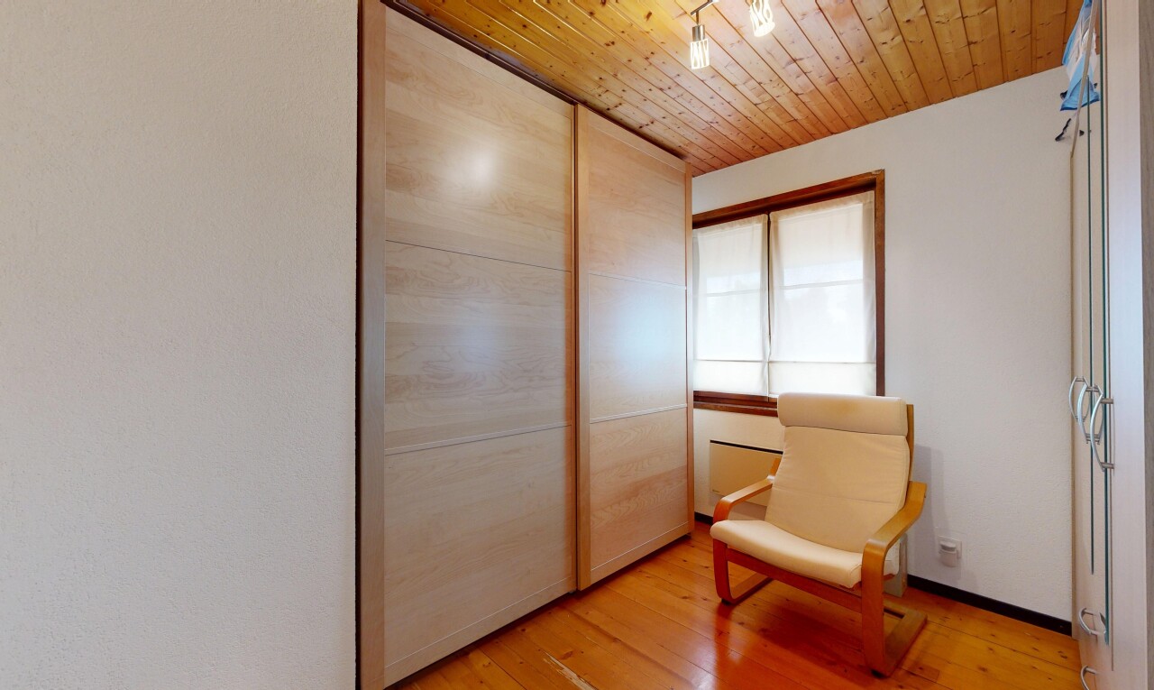 room featuring light wood-style floors, wood ceiling, and a closet