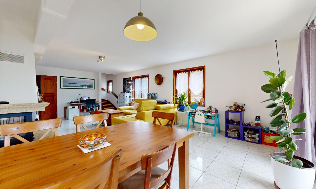dining room featuring light tile patterned floors and stairs