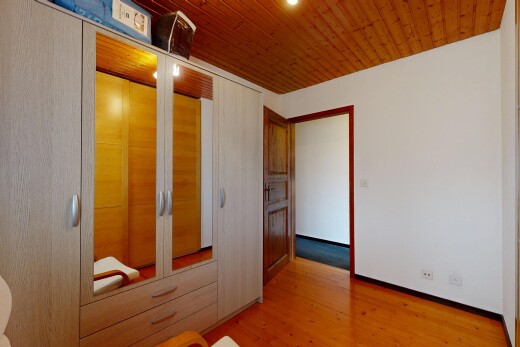unfurnished room featuring a closet, light wood finished floors, and wood ceiling