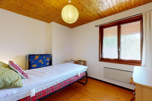 room with light wood finished floors, wooden ceiling, and radiator