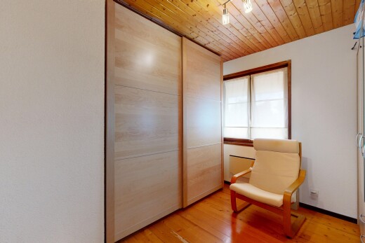 room featuring light wood-style floors, wood ceiling, and a closet