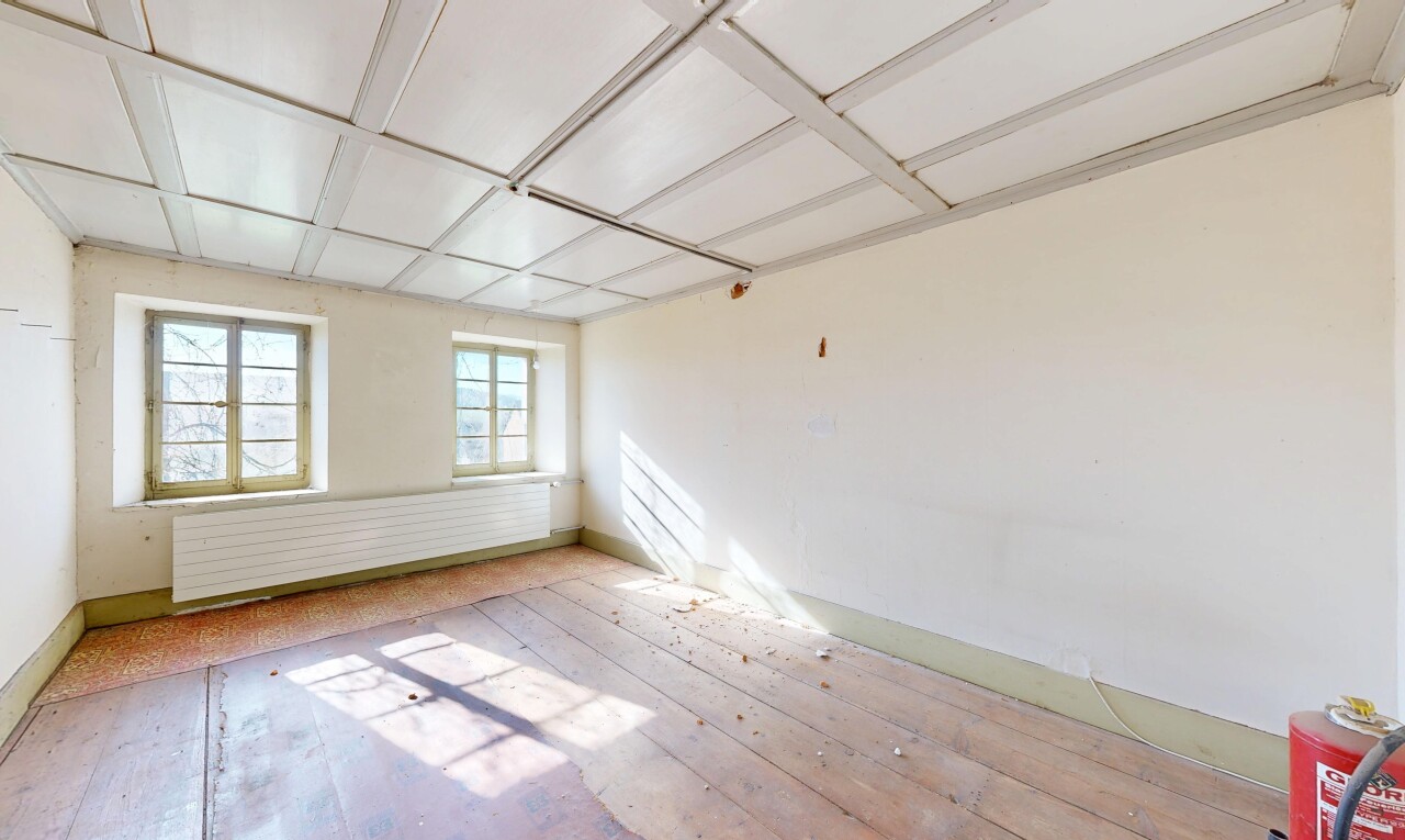 pièce vide avec cloison sèche, drywall, sol en finition bois, wood finish floor, et inside property