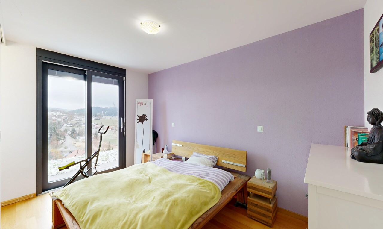 chambre avec inside property, accès à l'extérieur, wood finish floor, sol en finition bois, et natural light