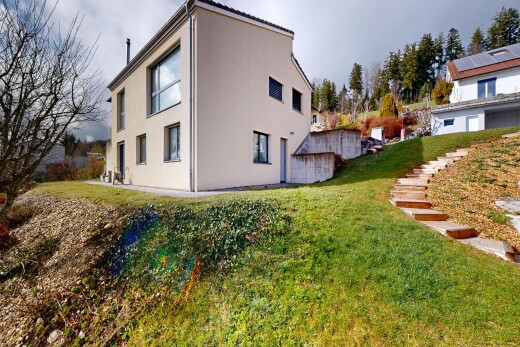 außenansicht mit rasen, stuckverkleidung, und property visible